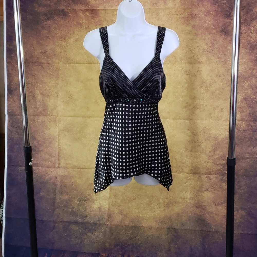 Anxiety black and white sleeveless blouse.